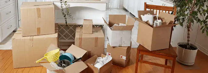 Packed moving boxes and household items in a kitchen before move-out or move-in cleaning, Allentown, PA.